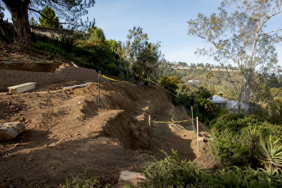 Sloped hillside lot ready for pool installation