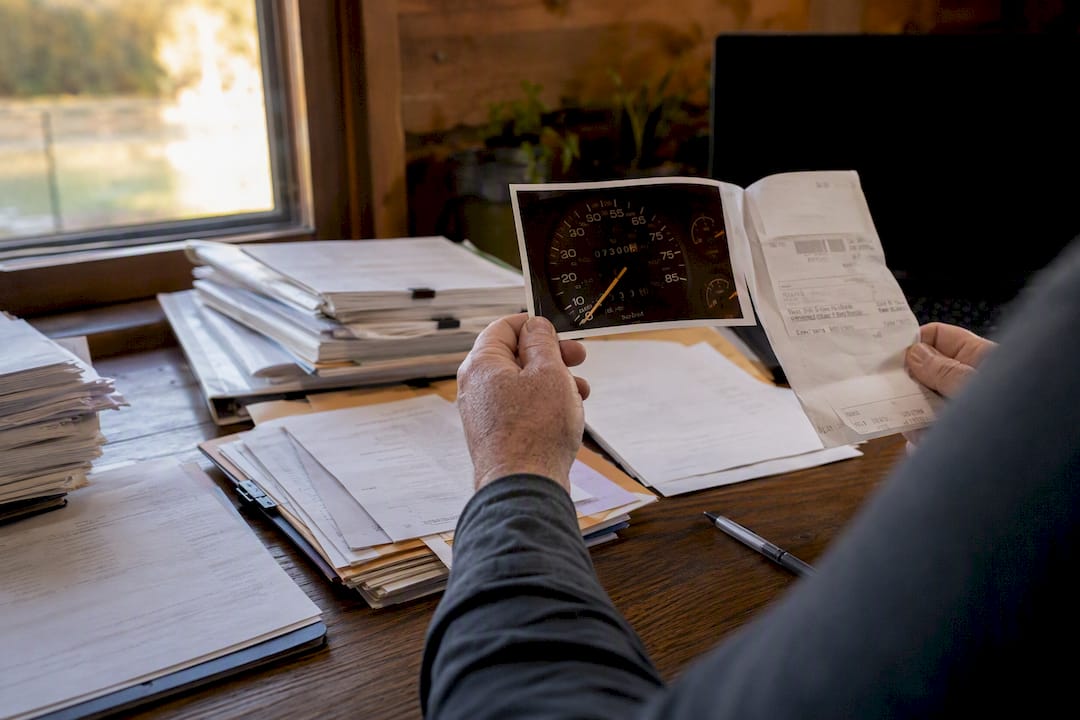 RV repair documents organized on table