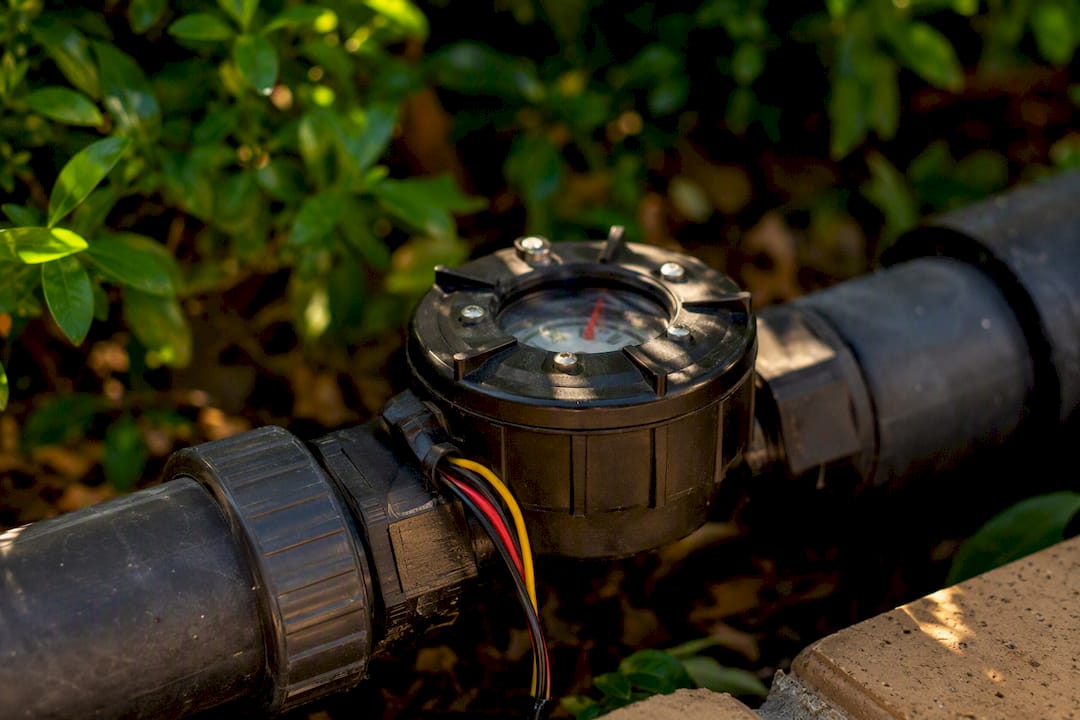 Flow sensor installed on irrigation mainline pipe