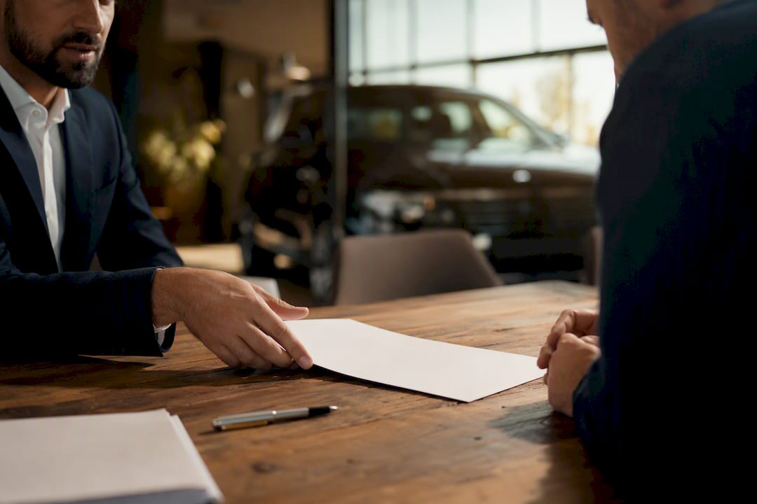 Finance desk with contract and car key fob
