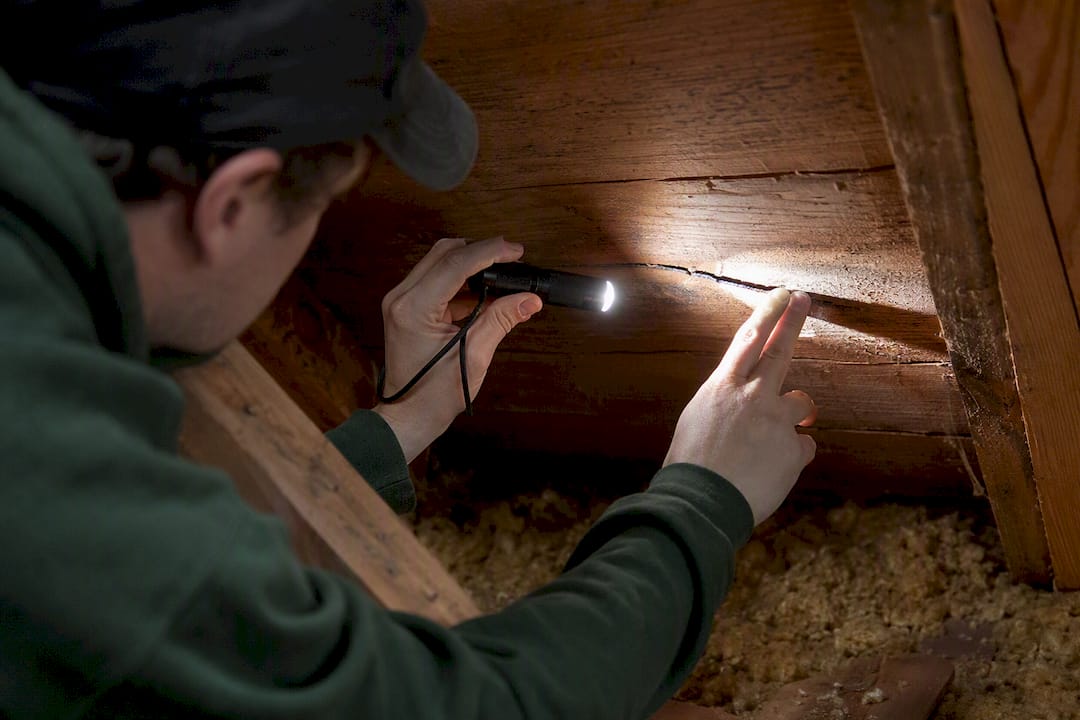 Daylight shining through attic roof board hole