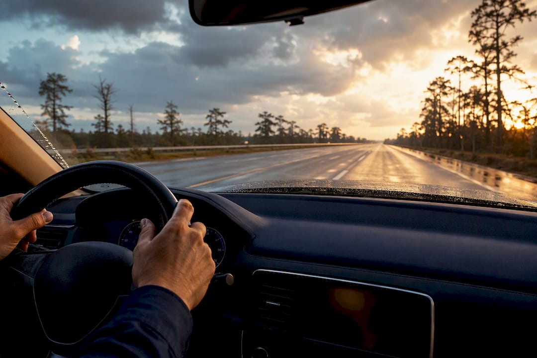 Driver traveling Louisiana roadway after rain
