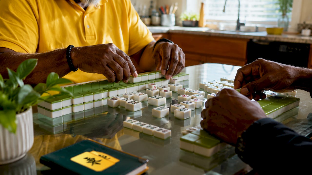 Hands matching mahjong tiles in calm setting