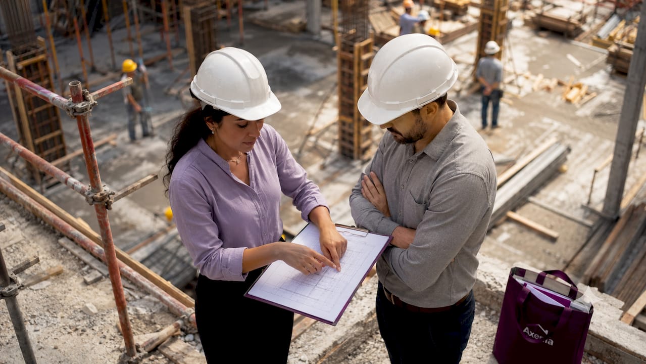 Construction manager advising client on site