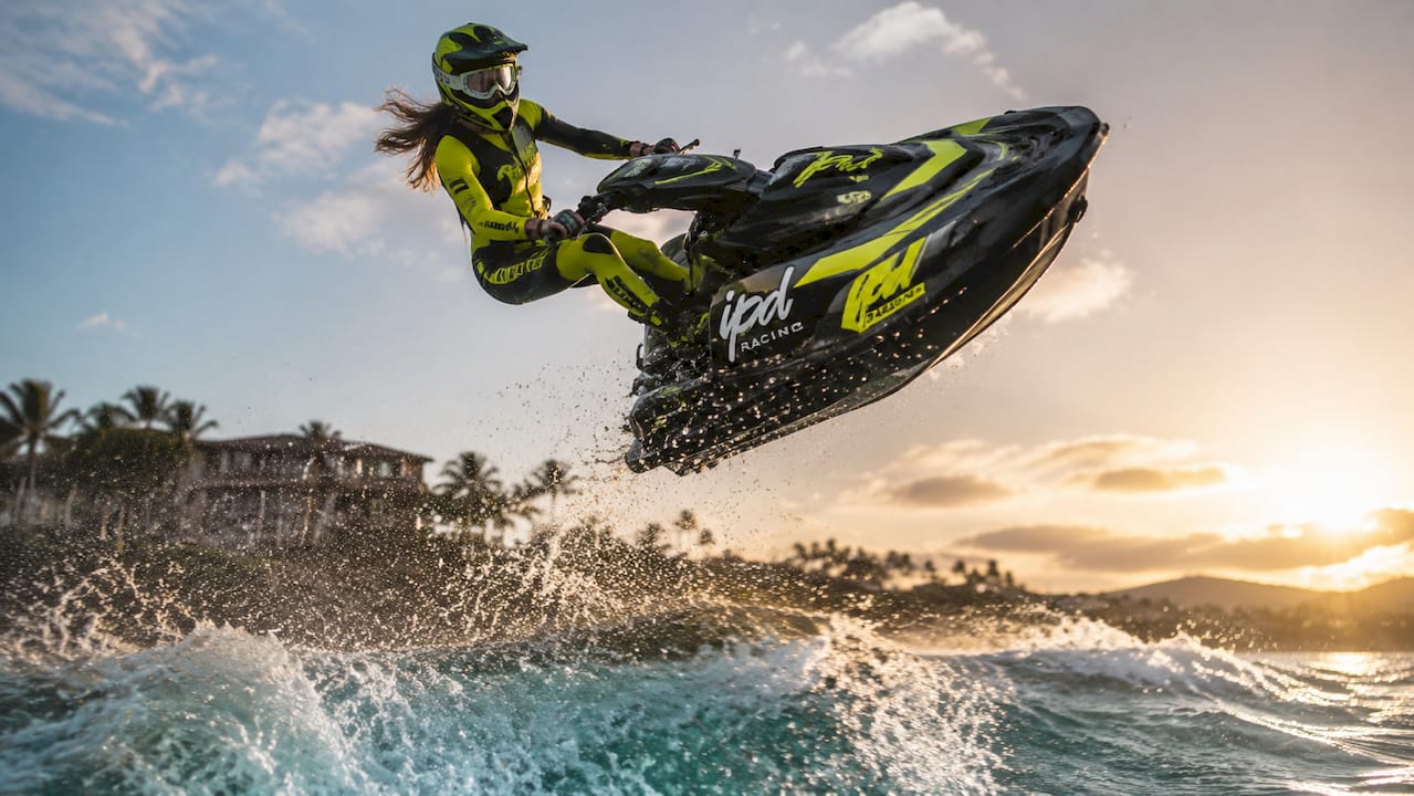 Overhead view of jet ski rider adjusting body for spin