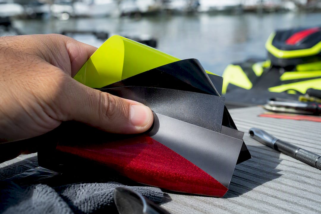 Hand flexing marine vinyl wrap samples