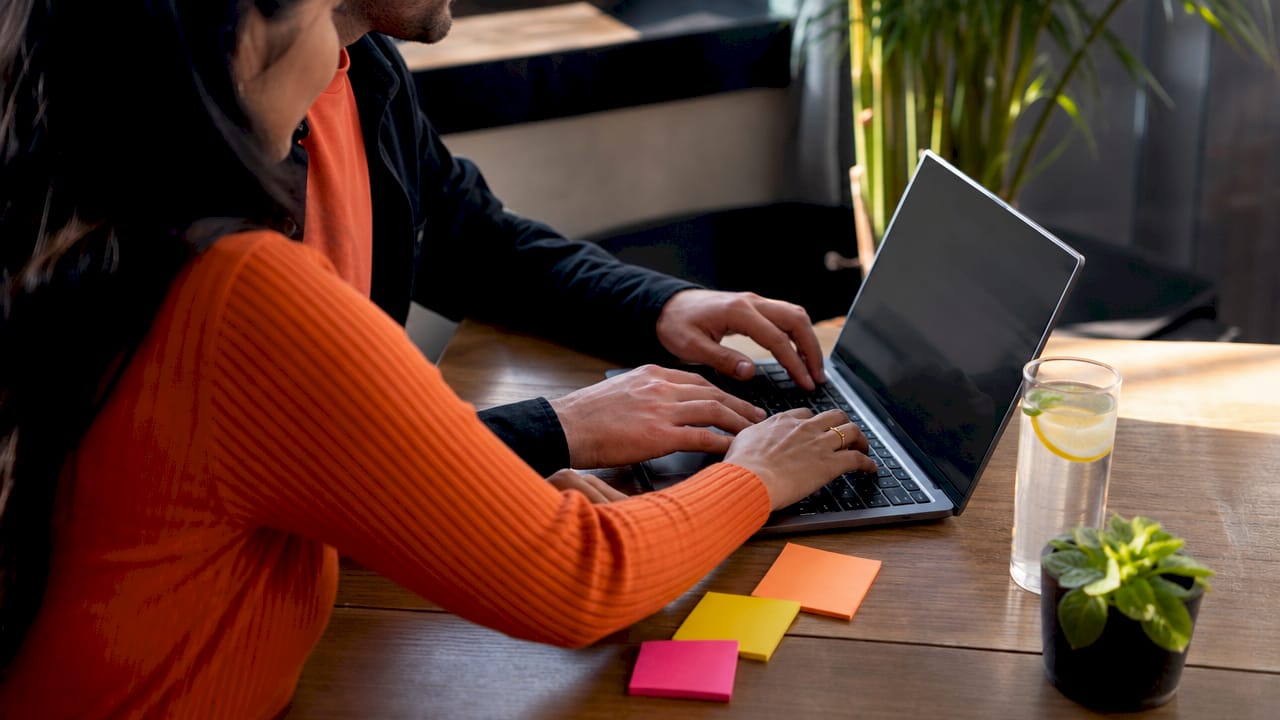 Hands typing on keyboard for data integration