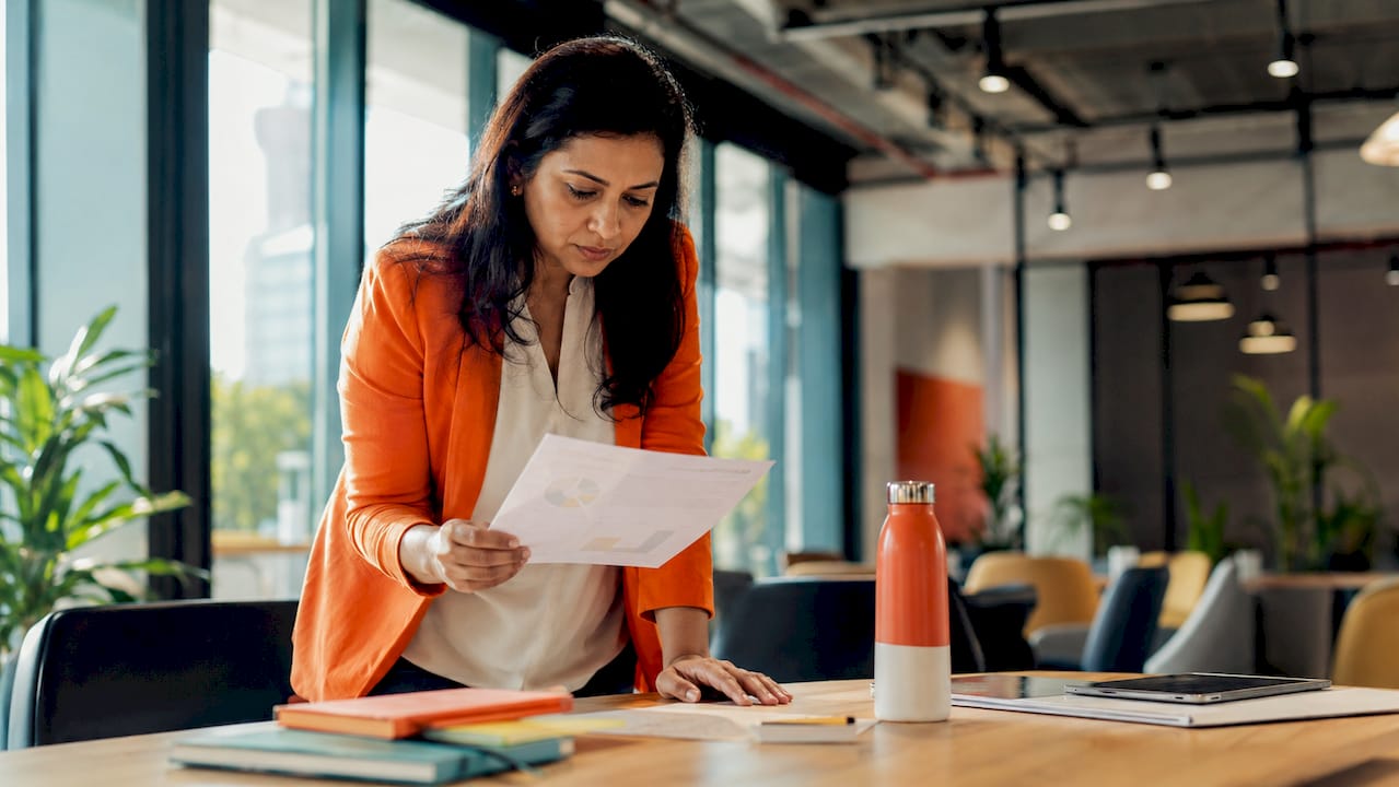 Woman engaging with AI CRM automation on tablet