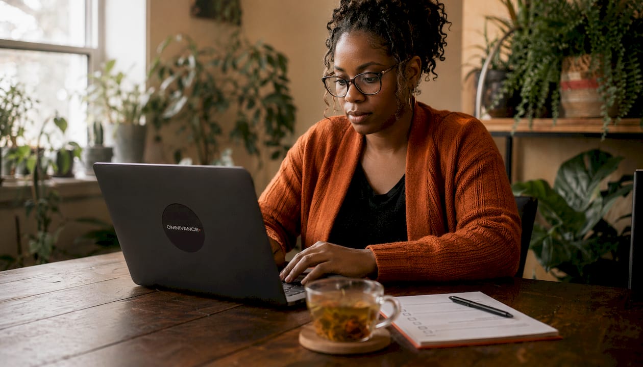 Woman editing Google Business Profile for plumber
