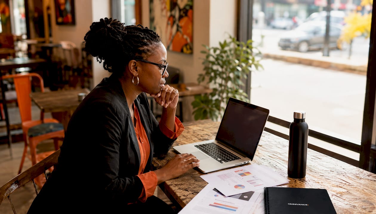 Woman reviewing AI search optimization data