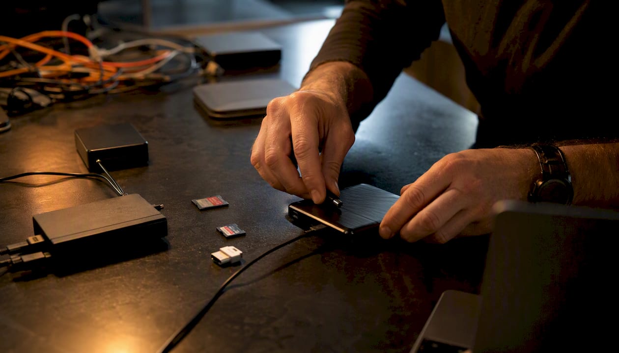 Hands configuring marketing data devices