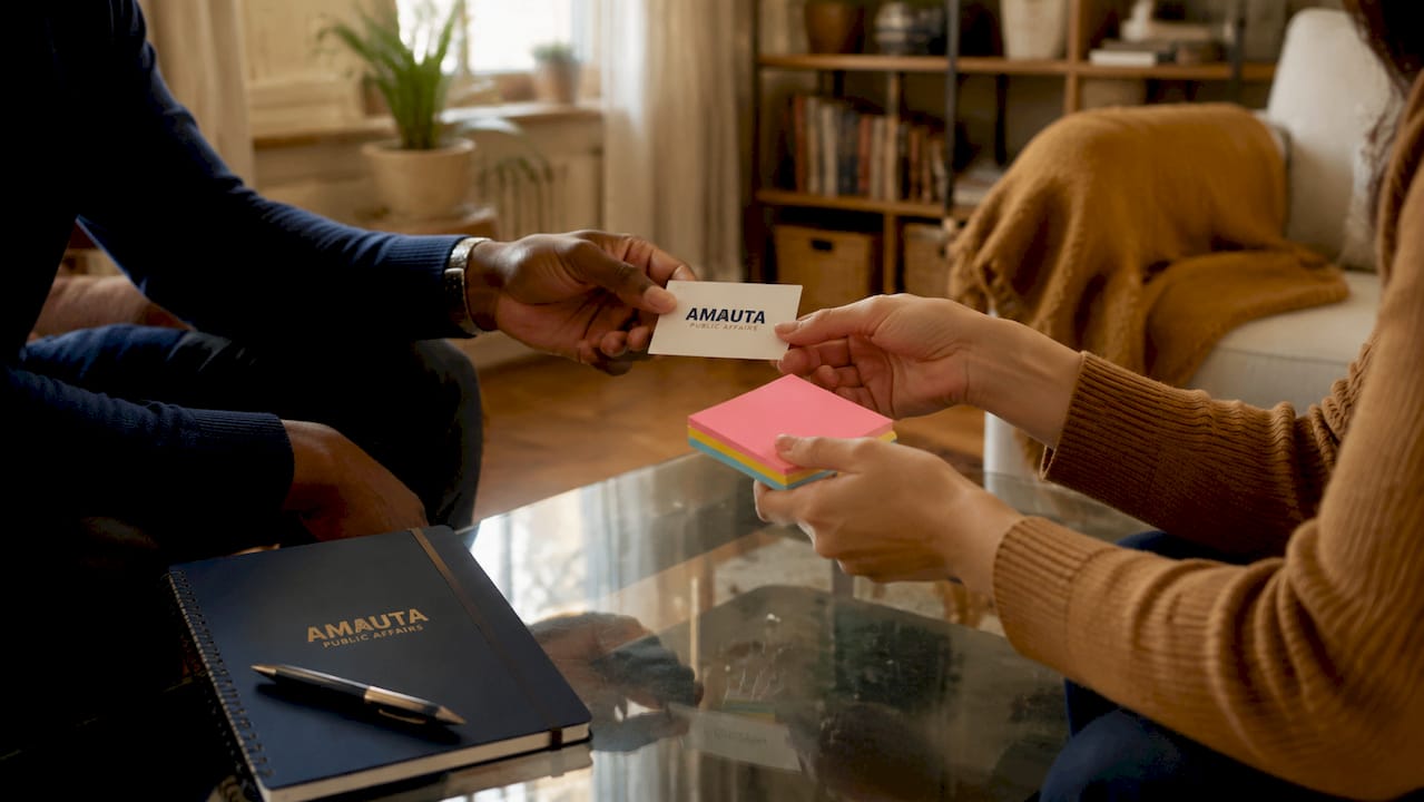 Hands exchanging contact cards during organizing