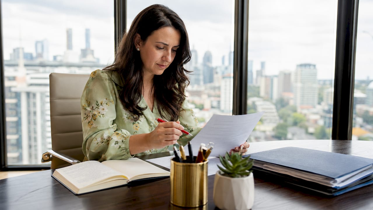 PR professional reviewing press release drafts