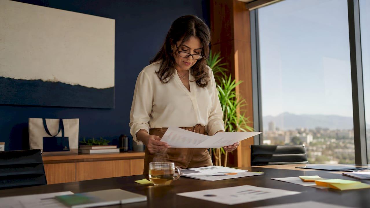 Businesswoman reviewing reputation feedback at desk
