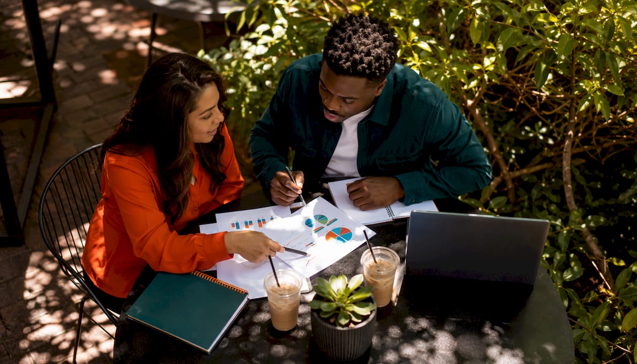 Two SEO professionals discussing keyword intent data
