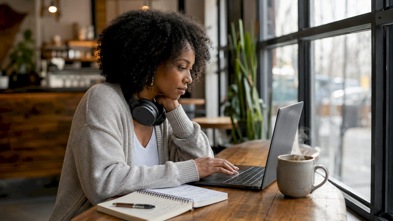 Woman creating RB wedding music playlist