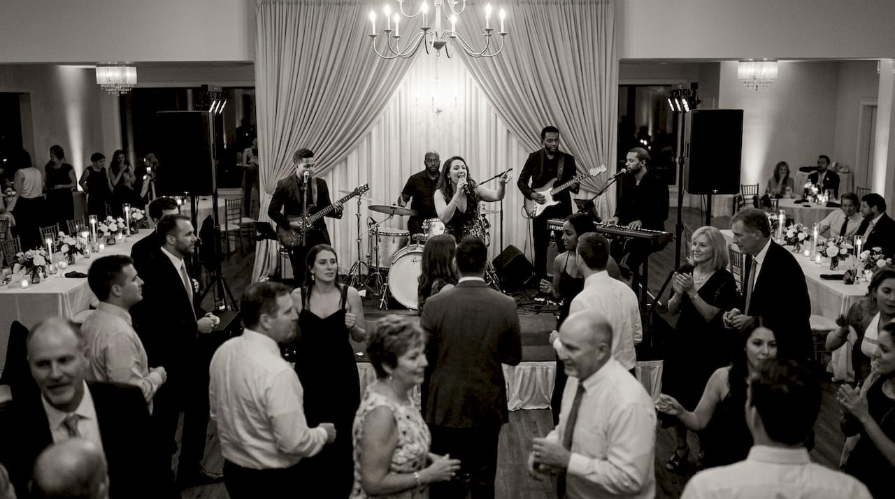 Wedding band engaging guests during performance