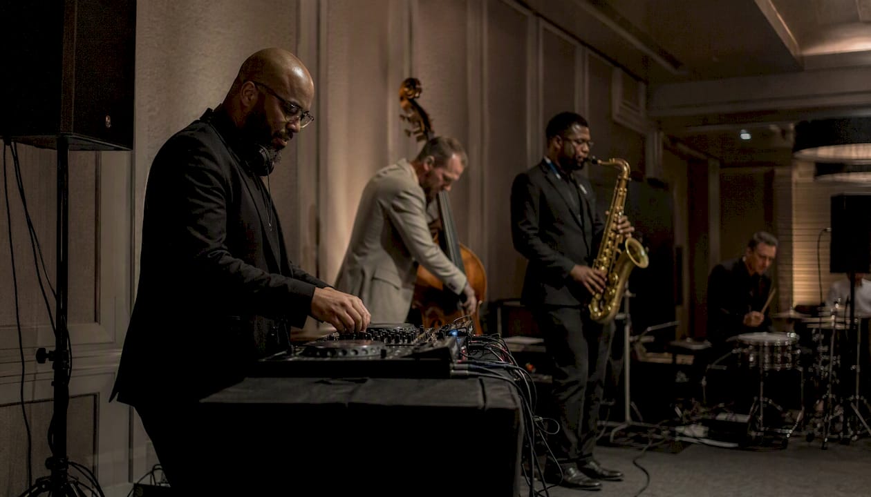 Live band and DJ hybrid performing at event