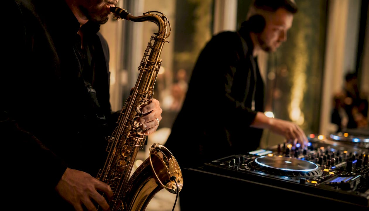 Saxophone player performing beside DJ