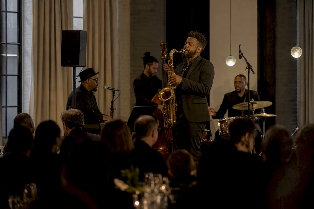 Saxophonist performing at small weekday wedding