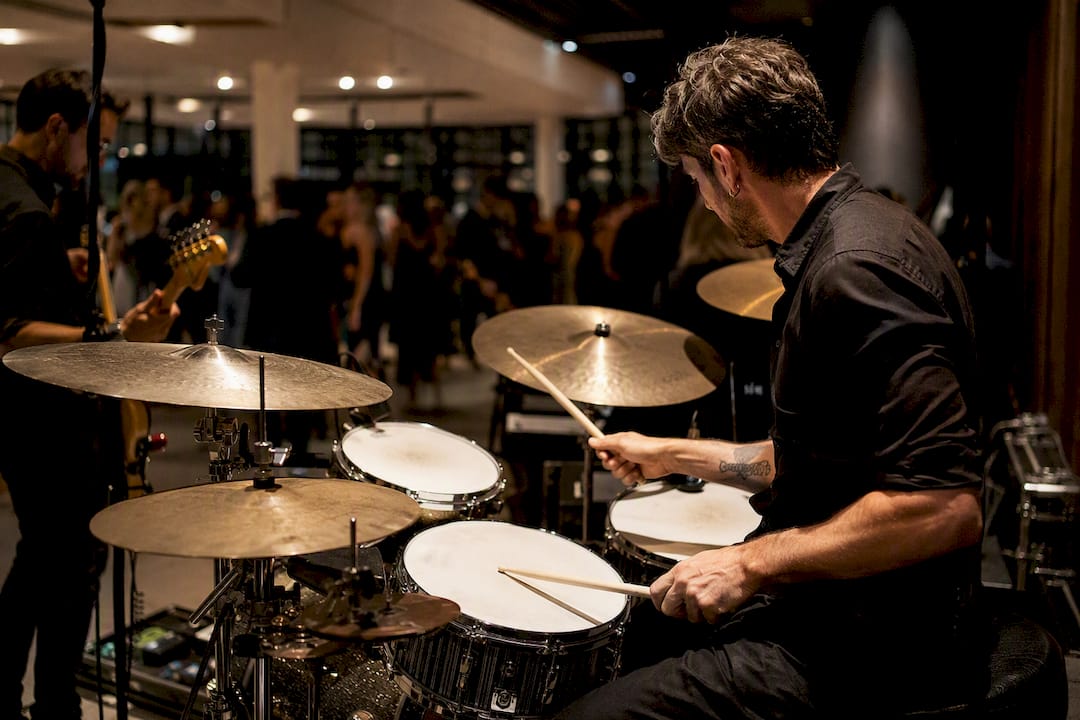 Drummer performing at weekday wedding reception