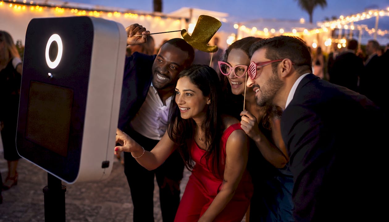 Guests enjoying photo booth at corporate gala