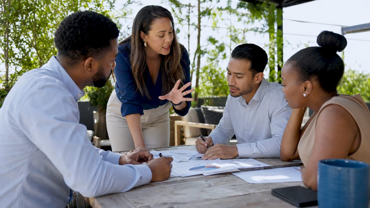 Team discussing AI report in conference room