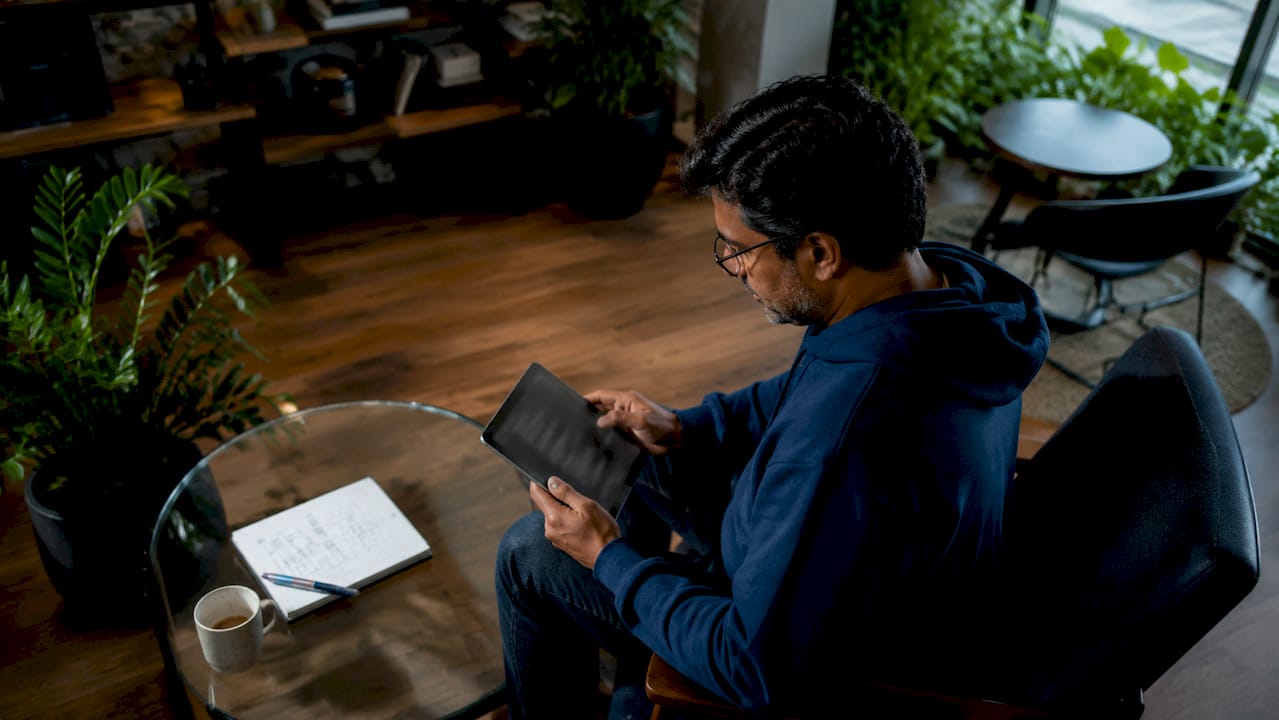 Engineering lead reviewing project context on tablet