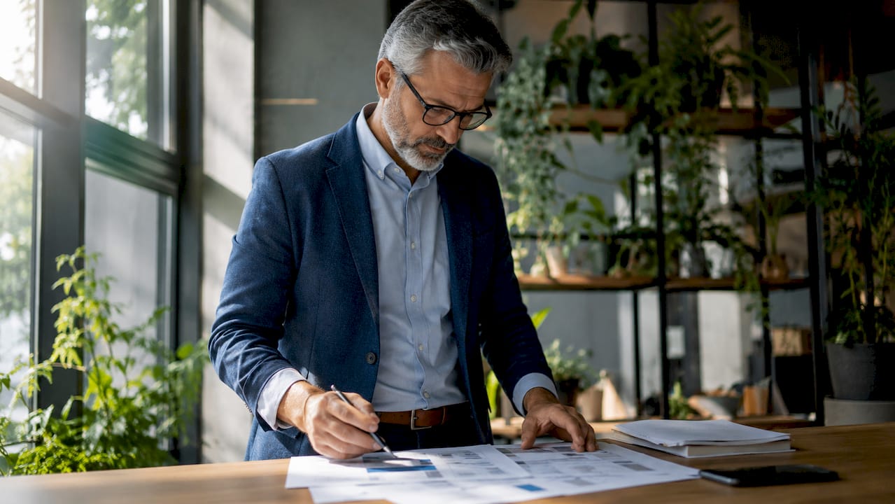 Senior IT manager reviewing AI update plans