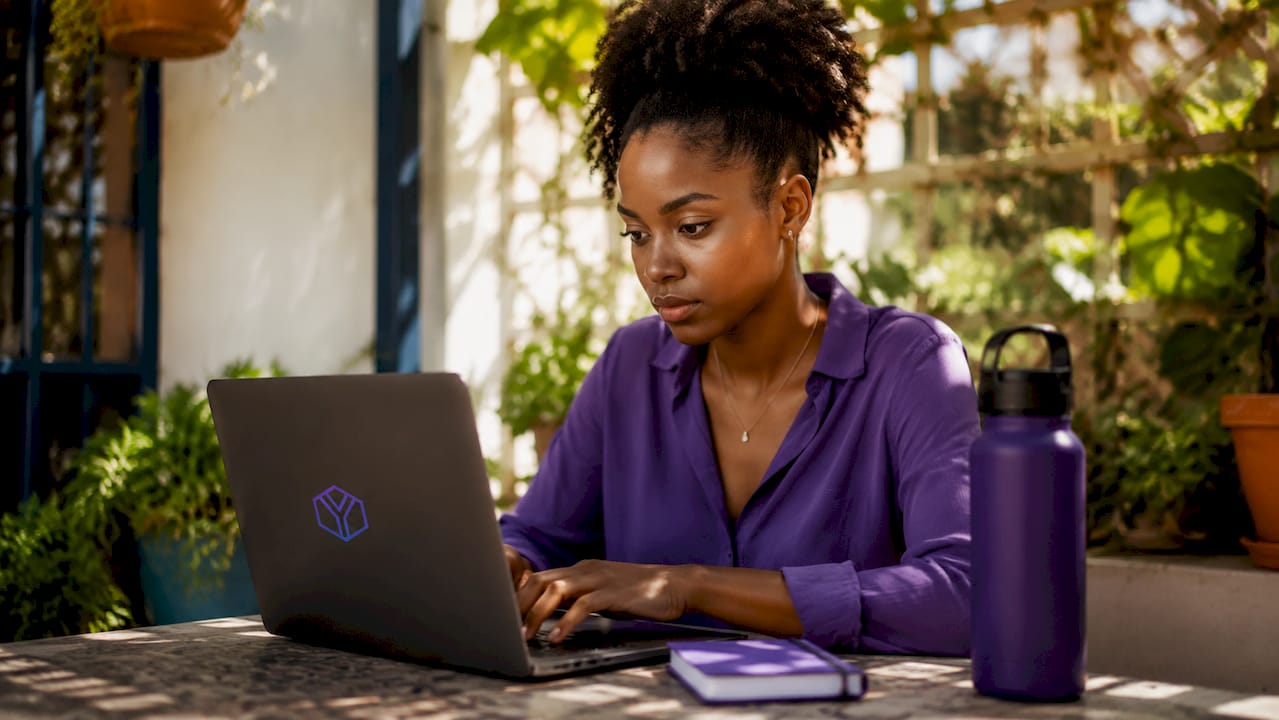 Woman configuring secure document sharing on laptop