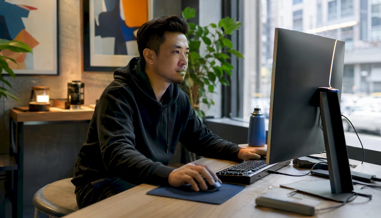 IT specialist configuring briefing software in server room