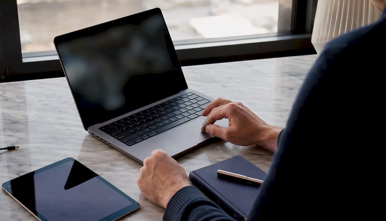 Founder hands working on laptop securing raise room