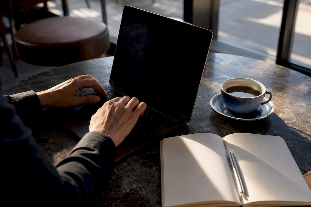 Hands poised over laptop preparing follow-up