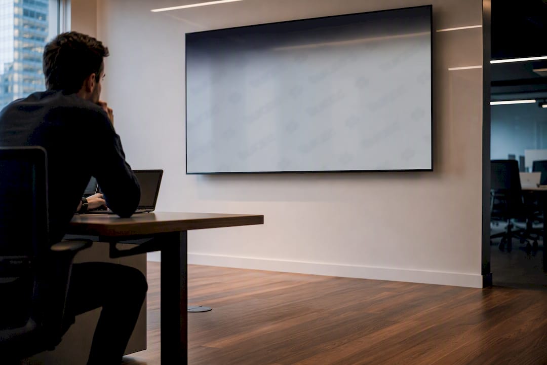 Presentation slide with visible watermark on dark screen