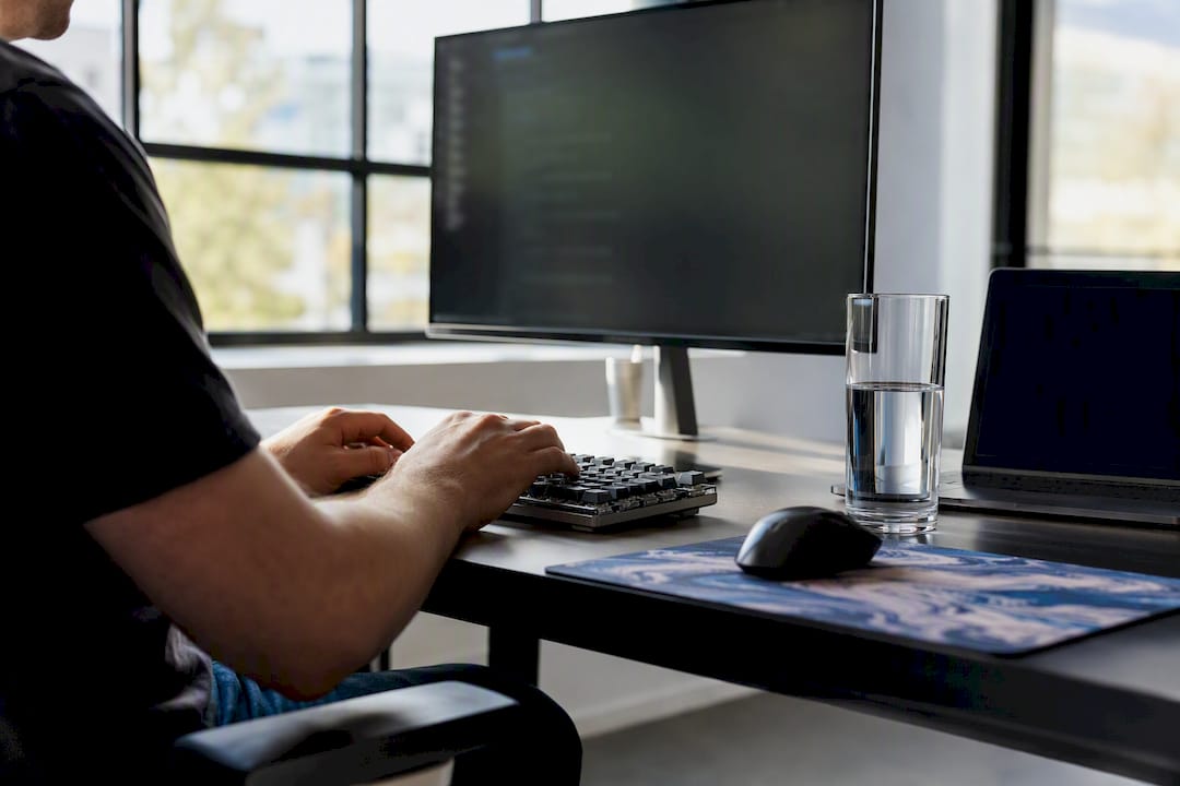 Developer hands typing code for autonomous agents