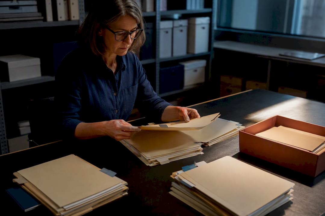 Specialist sorting documents into evidence groups