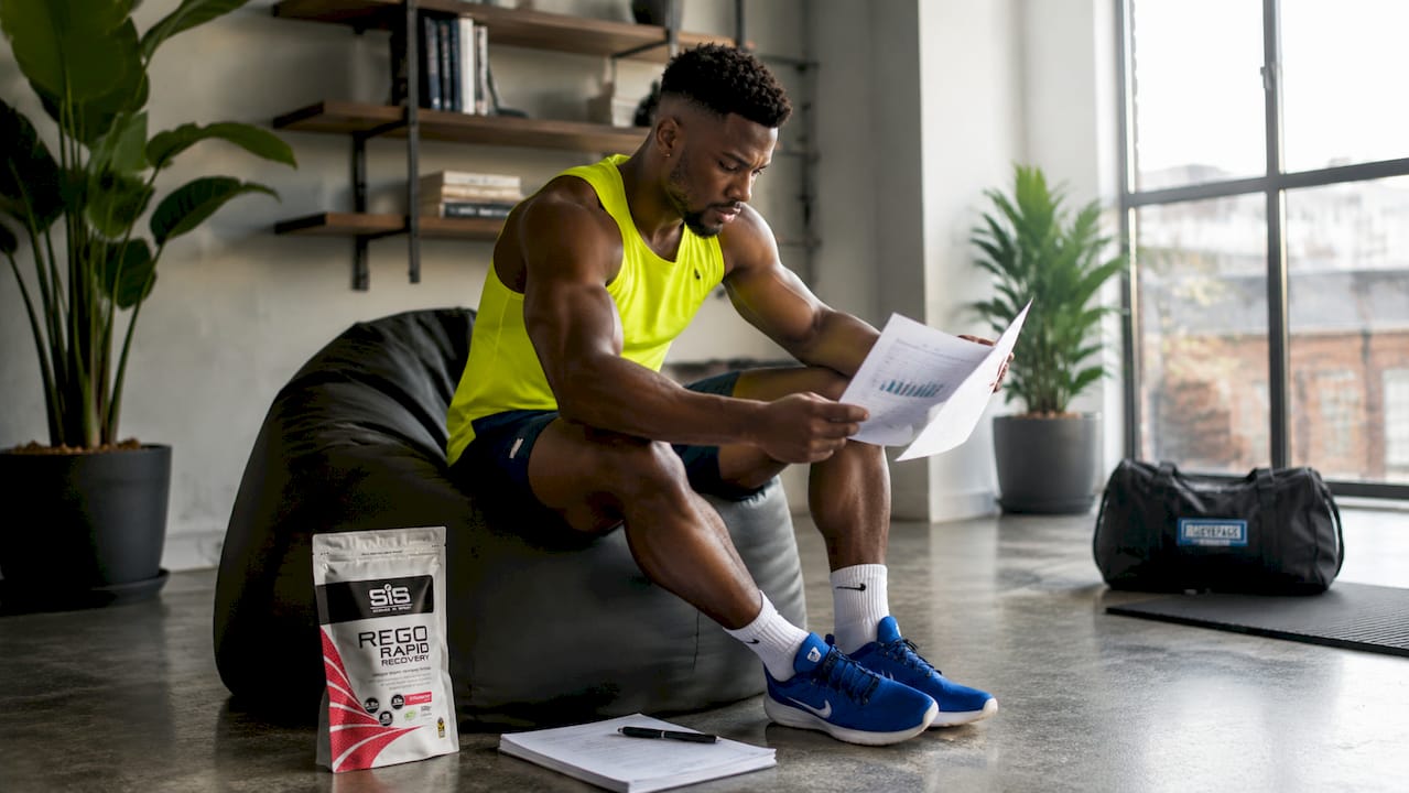 Athlete reading supplement research papers
