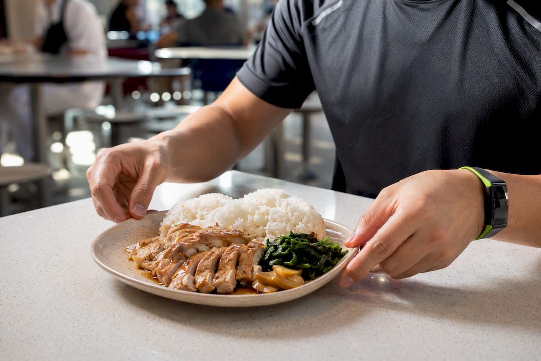 Athlete estimating balanced hawker meal portions