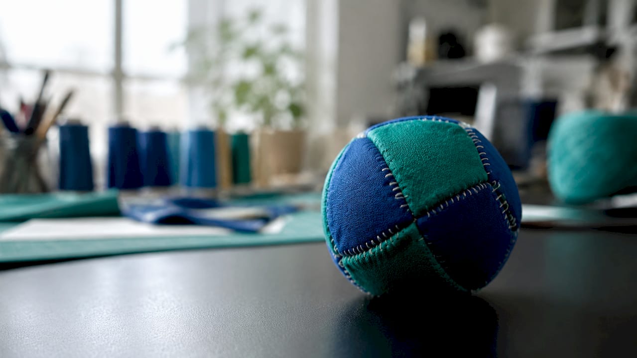 Close-up of suede hacky sack stitching