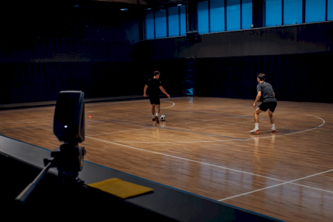 Camera tracking athletes during training drill