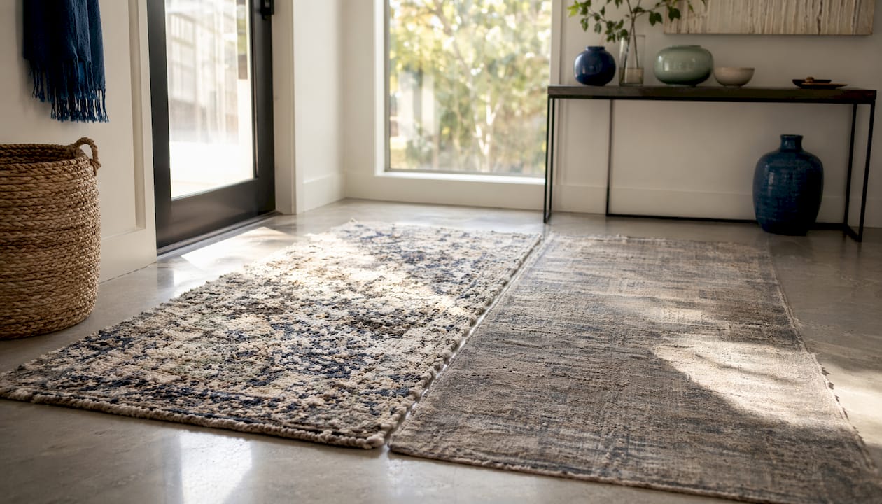 Close-up comparison of wool and synthetic rug fibers