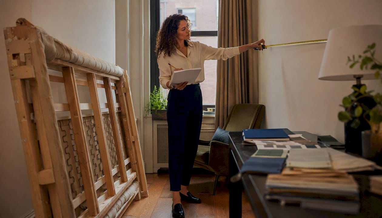 Designer measuring alcove for custom sofa