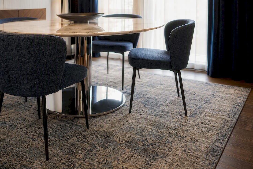 Vintage distressed rug in formal dining room setting