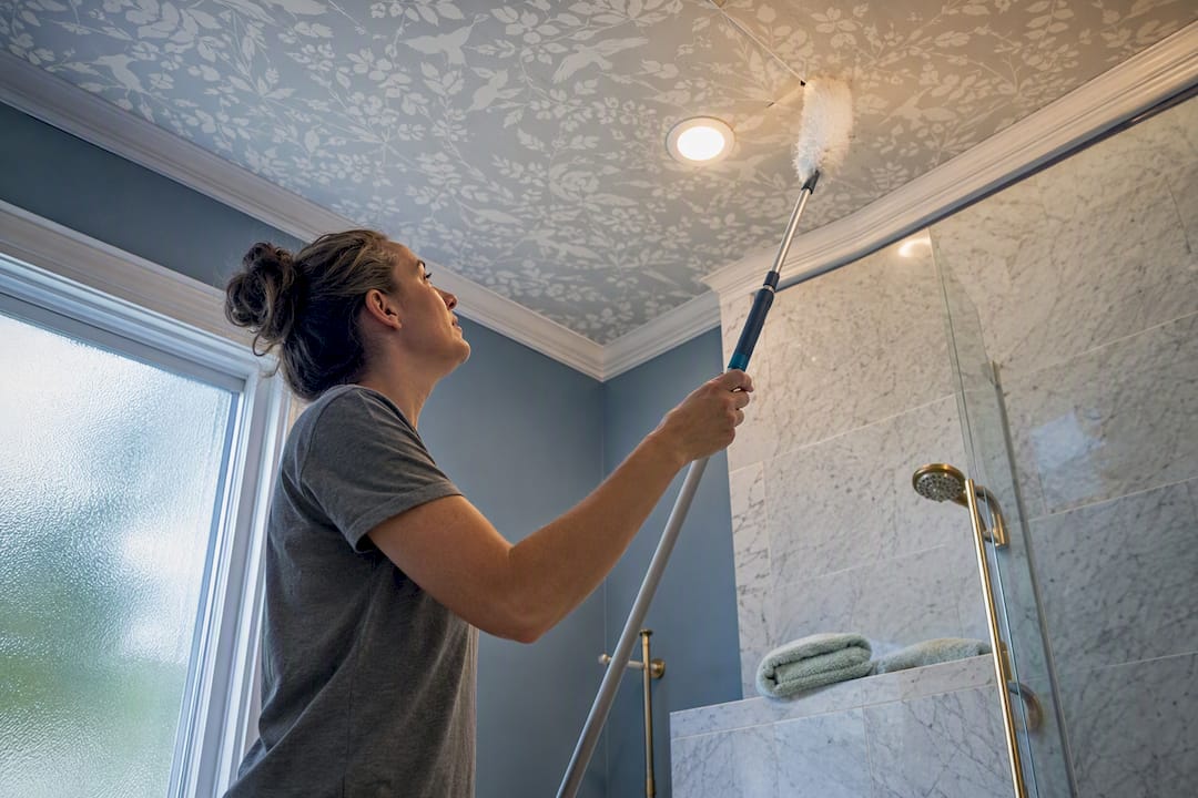 Duster checking ceiling wallpaper seam