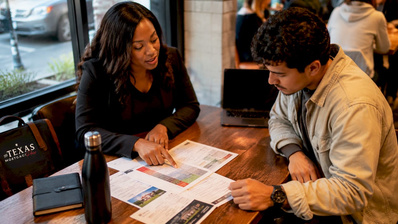 Mortgage broker explaining loans to client