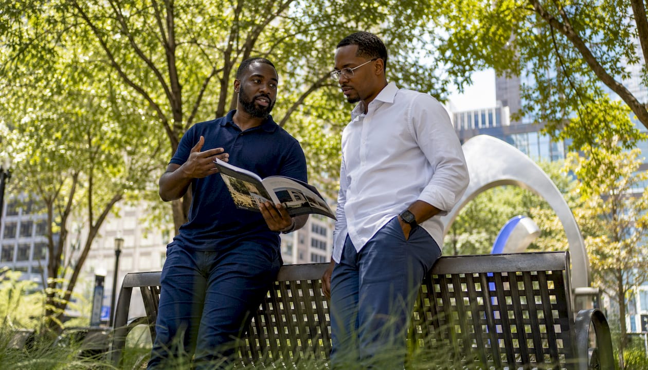 Two men discussing mortgage loan options