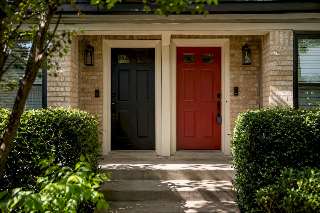 Duplex front doors in Texas residential neighborhood