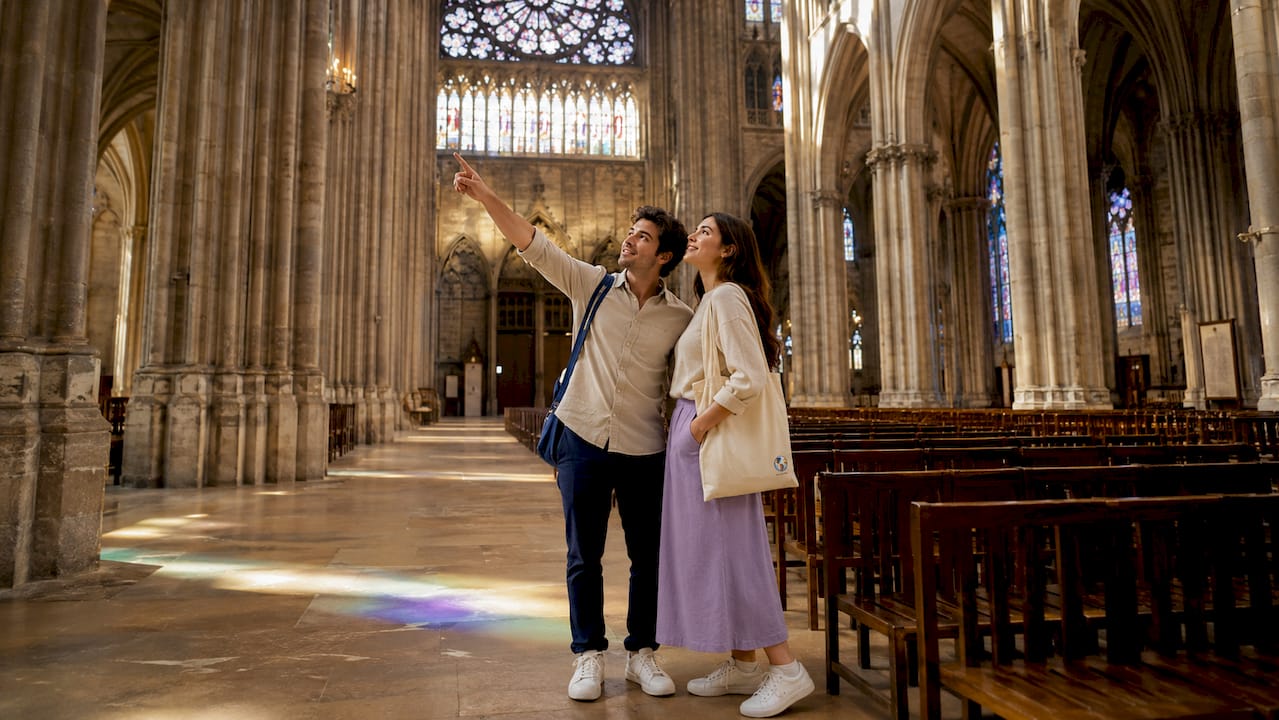 Tourists admiring Notre-Dame Gothic architecture