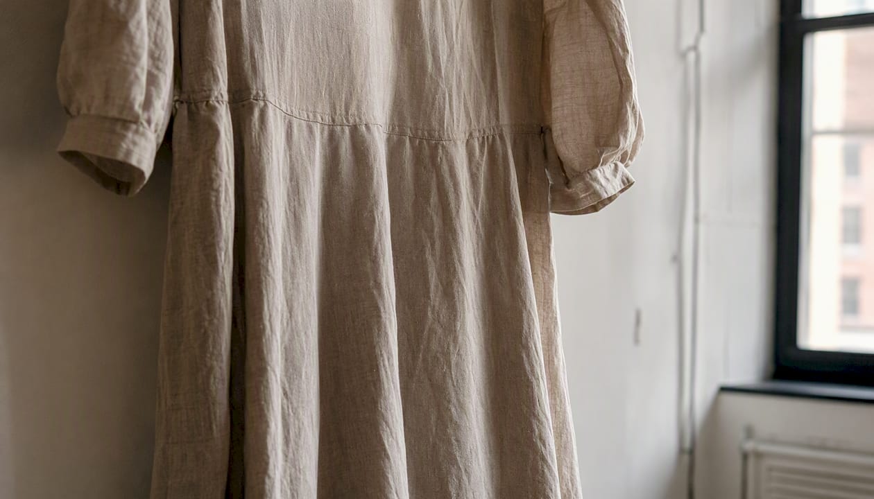 Close-up of linen midi dress fabric and silhouette