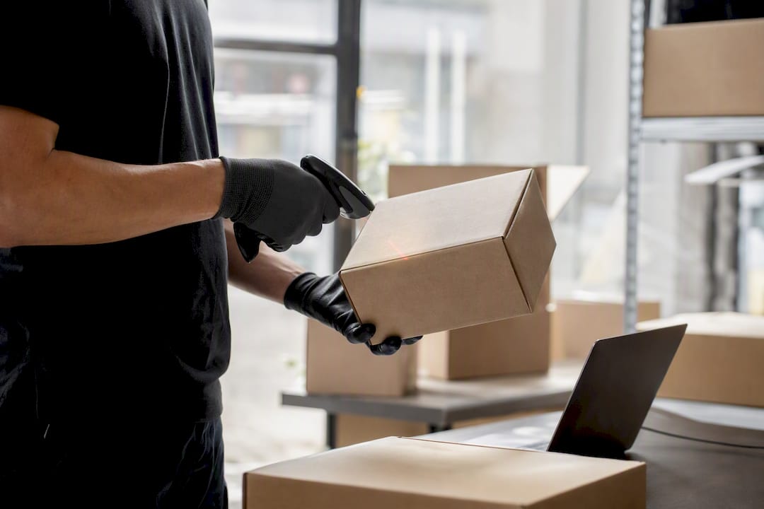 Courier scanning international shipment parcel